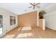 Living room with hardwood floors, neutral walls, and access to backyard at 10927 E Cholla Rd, Mesa, AZ 85207