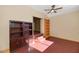 Home office with built-in shelving and hardwood floors at 10927 E Cholla Rd, Mesa, AZ 85207