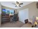 Bright bedroom with a workspace and built-in shelving at 11453 N 24Th Dr, Phoenix, AZ 85029