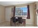 Small dining area with table and chairs, near kitchen at 11453 N 24Th Dr, Phoenix, AZ 85029