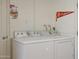 Convenient laundry room with side-by-side washer and dryer at 11453 N 24Th Dr, Phoenix, AZ 85029