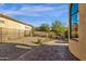 Gravel backyard with a walkway and wrought iron fence at 11729 N 134Th St, Scottsdale, AZ 85259