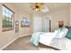 Bright bedroom with tiled floors and a ceiling fan at 11729 N 134Th St, Scottsdale, AZ 85259