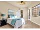 Comfortable bedroom with a queen bed and access to private patio at 11729 N 134Th St, Scottsdale, AZ 85259