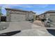 Craftsman style home with stone accents and a two-car garage at 11729 N 134Th St, Scottsdale, AZ 85259