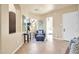 Bright hallway with seating area and access to other rooms at 11729 N 134Th St, Scottsdale, AZ 85259