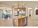 Open kitchen with large island and breakfast bar at 11729 N 134Th St, Scottsdale, AZ 85259