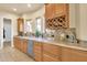 Kitchen features granite countertops, wine rack, and stainless steel appliances at 11729 N 134Th St, Scottsdale, AZ 85259