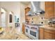 Gourmet kitchen with a professional range and ample cabinetry at 11729 N 134Th St, Scottsdale, AZ 85259