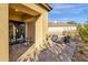 Covered patio features a table and chairs, perfect for outdoor dining at 11729 N 134Th St, Scottsdale, AZ 85259