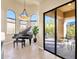 Sunroom with grand piano, access to patio, and abundant natural light at 11729 N 134Th St, Scottsdale, AZ 85259