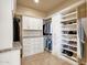 Large walk-in closet with shelving and drawers at 11729 N 134Th St, Scottsdale, AZ 85259