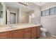 Clean bathroom, featuring a double vanity and shower at 12815 W Milton Dr, Peoria, AZ 85383