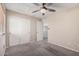 Spacious bedroom with double doors and carpet at 12815 W Milton Dr, Peoria, AZ 85383