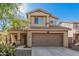 Two-story house with a brown door and garage at 12815 W Milton Dr, Peoria, AZ 85383