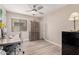 Bright home office with wood laminate flooring and ample storage at 12815 W Milton Dr, Peoria, AZ 85383