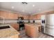 Eat-in kitchen with granite countertops and stainless steel appliances at 12815 W Milton Dr, Peoria, AZ 85383