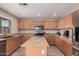 Spacious kitchen featuring an island and modern appliances at 12815 W Milton Dr, Peoria, AZ 85383