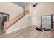 Two-story living room with hardwood floors and staircase at 12815 W Milton Dr, Peoria, AZ 85383