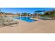 Relaxing pool area with lounge chairs and a swim-up entrance at 12815 W Milton Dr, Peoria, AZ 85383