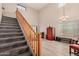 Elegant wooden staircase with carpeted steps leading to the upper level at 12815 W Milton Dr, Peoria, AZ 85383