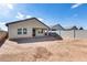 Backyard view of house and empty lot at 12958 E Larrea Ln, Florence, AZ 85132