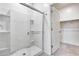 Bathroom with shower and built-in shelving at 12958 E Larrea Ln, Florence, AZ 85132