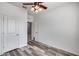 Bright bedroom with ceiling fan and wood-look flooring at 12958 E Larrea Ln, Florence, AZ 85132