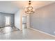 Bright dining area with tile floors and chandelier at 12958 E Larrea Ln, Florence, AZ 85132