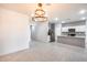 Modern kitchen with island and granite countertops at 12958 E Larrea Ln, Florence, AZ 85132