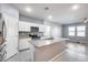 Modern kitchen with white cabinets and granite island at 12958 E Larrea Ln, Florence, AZ 85132