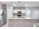 Modern kitchen with stainless steel appliances and granite countertops at 12958 E Larrea Ln, Florence, AZ 85132