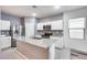 Modern kitchen featuring granite countertops and white cabinetry at 12958 E Larrea Ln, Florence, AZ 85132