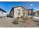 Landscaped side yard with drought-tolerant plants at 12958 E Larrea Ln, Florence, AZ 85132