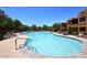 Relaxing community pool area with plenty of lounge chairs at 13450 E Via Linda -- # 1010, Scottsdale, AZ 85259