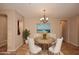 Elegant dining room with ornate table and chandelier at 13450 E Via Linda -- # 1010, Scottsdale, AZ 85259