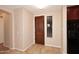 Inviting entryway with a wood door and tile flooring at 13450 E Via Linda -- # 1010, Scottsdale, AZ 85259