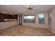 Bright living room with tile floors, fireplace, and large windows at 13450 E Via Linda -- # 1010, Scottsdale, AZ 85259