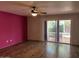 Bright living room with wood floors and a sliding door to the patio at 136 E Boca Raton Rd, Phoenix, AZ 85022