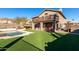 Large backyard with pool, artificial turf and house at 14422 S 24Th Pl, Phoenix, AZ 85048