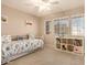 Bedroom with daybed, built-in shelving, and window blinds at 14422 S 24Th Pl, Phoenix, AZ 85048