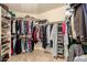 Large walk-in closet with ample shelving and hanging space at 14422 S 24Th Pl, Phoenix, AZ 85048