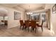 Elegant dining room with hardwood floors and a large window at 14422 S 24Th Pl, Phoenix, AZ 85048