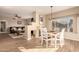 Bright dining area with hardwood floors and a view into the living room at 14422 S 24Th Pl, Phoenix, AZ 85048