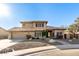 Two-story house with tile roof, landscaping, and a large driveway at 14422 S 24Th Pl, Phoenix, AZ 85048