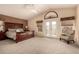 Serene main bedroom with plush carpeting and access to a balcony at 14422 S 24Th Pl, Phoenix, AZ 85048