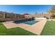 Relaxing pool with artificial turf and mountain views at 14422 S 24Th Pl, Phoenix, AZ 85048