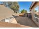 Landscaped side yard with storage shed and access gate at 14422 S 24Th Pl, Phoenix, AZ 85048