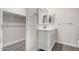 Clean bathroom with white vanity, large mirror, and walk-in shower at 16008 N Hollyhock St, Surprise, AZ 85378