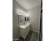 Clean bathroom with a white vanity and updated fixtures at 16008 N Hollyhock St, Surprise, AZ 85378